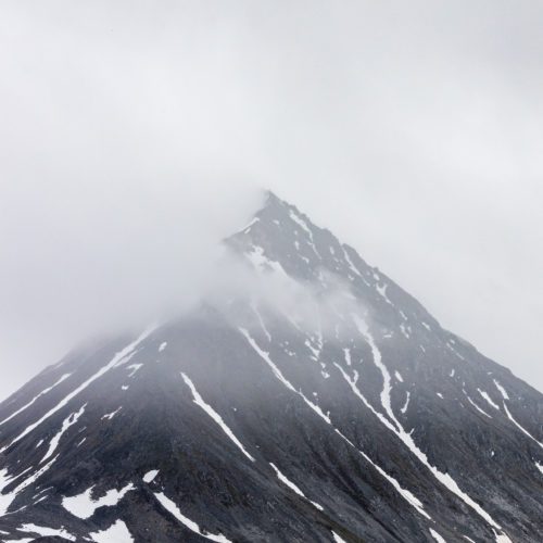 A moody capture of one the many sharp mountain tops Spitsbergen is named after.