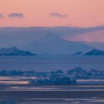 Sunset over Disko Bay during winter in Ilulissat, Greenland.