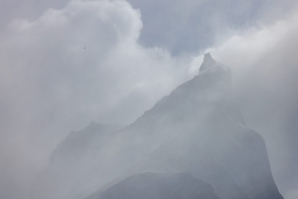 A condor soaring past one of the peaks.