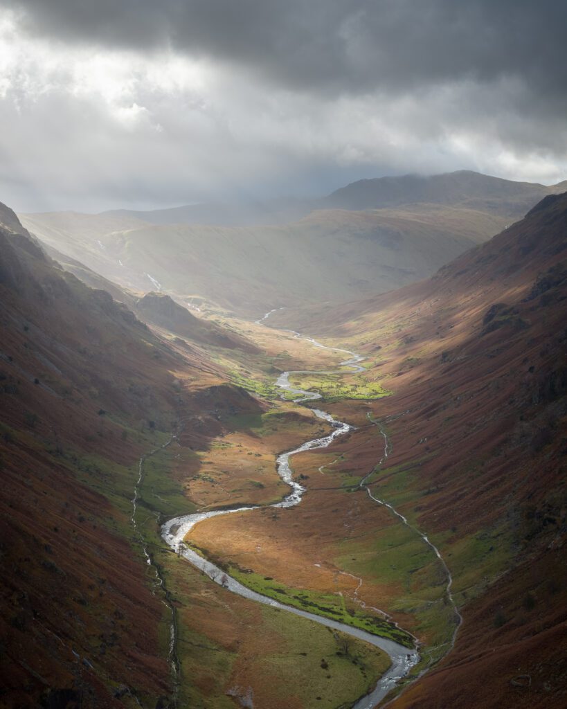 Sun beams hitting a valley in the Lake District in England