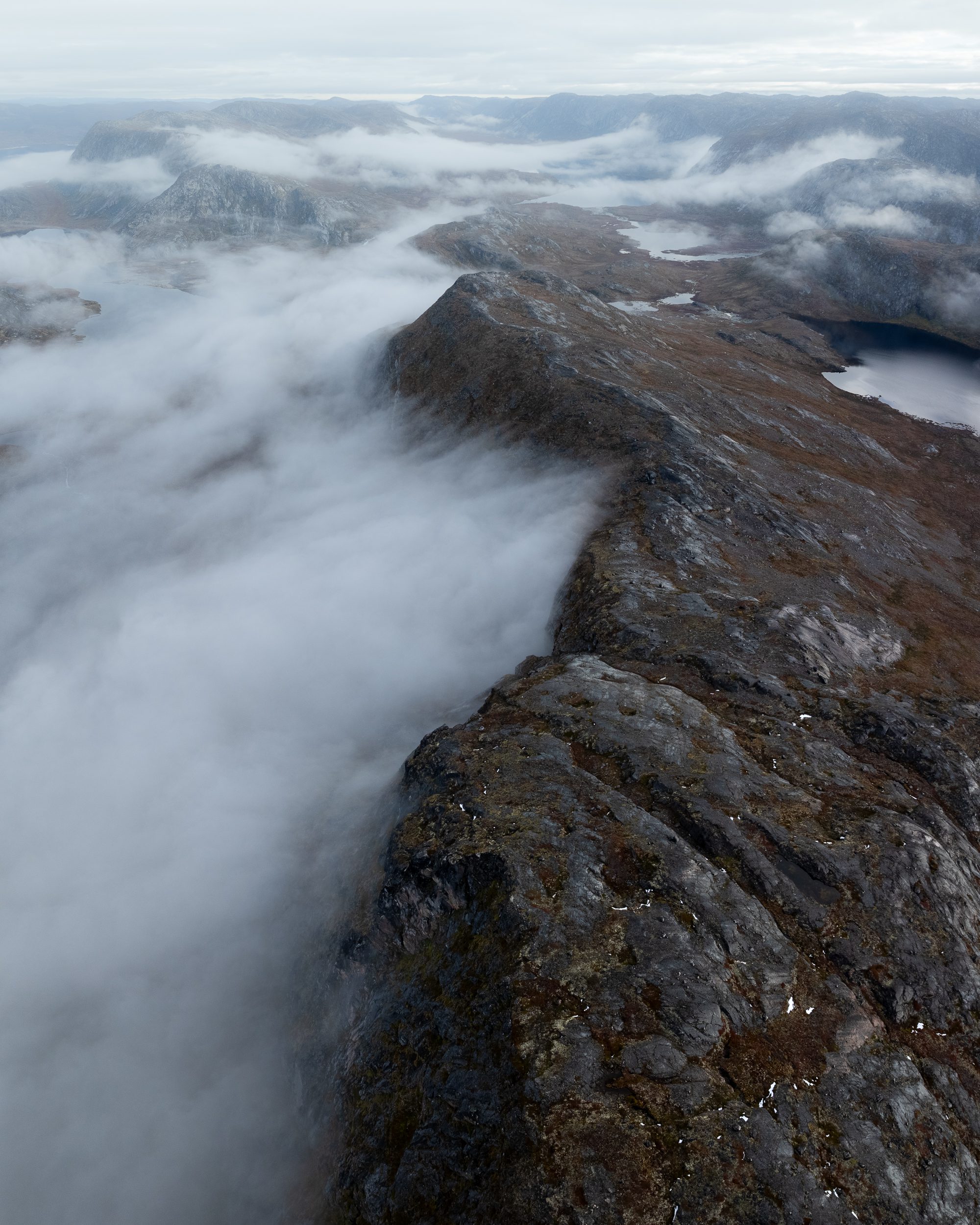 A cloud inversion pushing against a ridge line in Greenland