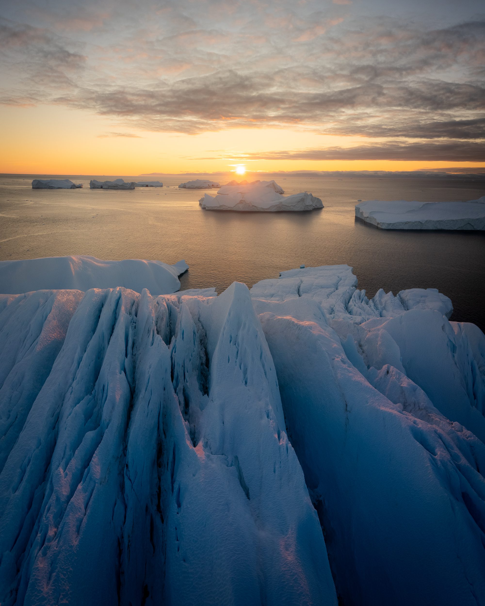 Sunset over an iceberg in the UNESCO Icefjord